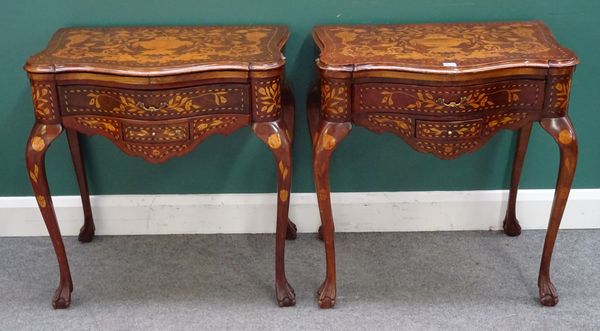 A pair of Dutch 18th century style marquetry inlaid side tables, each with serpentine top over pair of frieze drawers, on cabriole supports and ball a