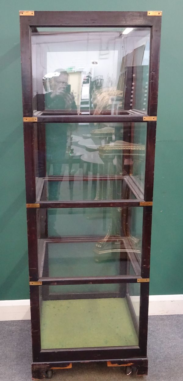 A mahogany and metal bound free-standing square display cabinet of campaign style, 61cm wide x 183cm high.