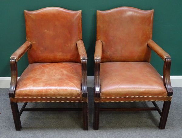 A pair of mid-18th century style mahogany framed Gainsborough chairs with studded rouge leather upholstery, on channelled square supports. 65cm wide x