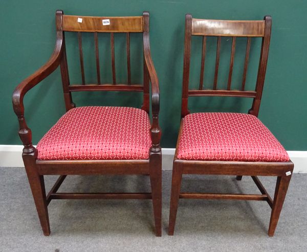 A set of eight late George III mahogany square back dining chairs, with straight front seats, on tapering square supports, to include a pair of carver