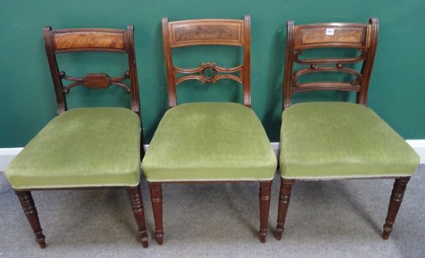 A matched set of thirteen George IV dining chairs, with straight front seats on turned supports, (13).