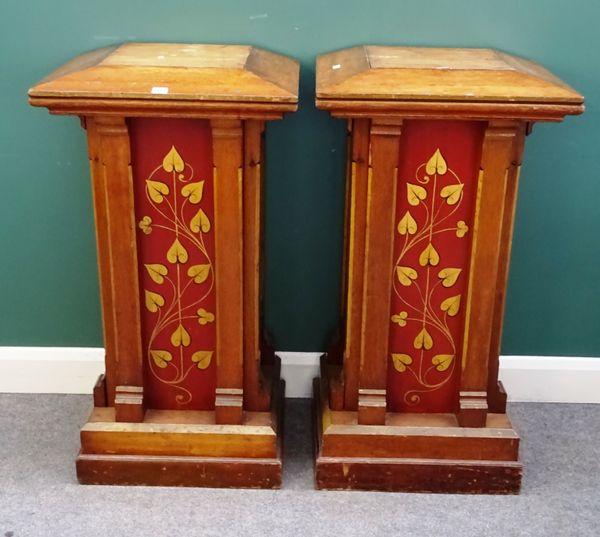 A pair of Gothic Revival style oak and polychrome painted pedestals, with swept square tops, 51cm wide x 104cm high x 45cm deep, (2).