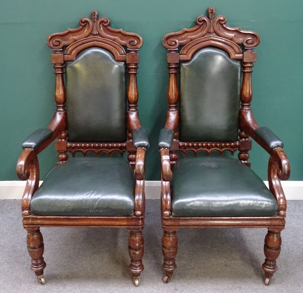 A pair of Victorian carved oak framed open armchairs, with straight front seats on bulbous turned supports, 60cm wide x 130cm high, (2).