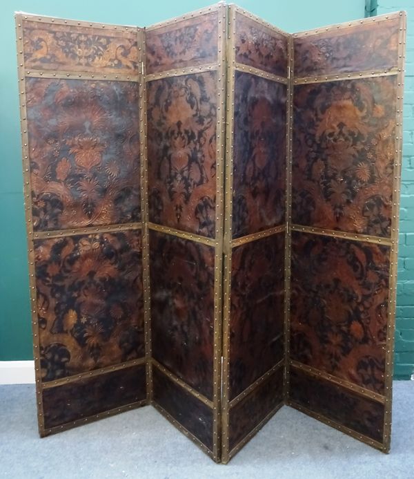 A 19th century floral embossed leather four fold draught screen. 248cm wide x 213cm high.