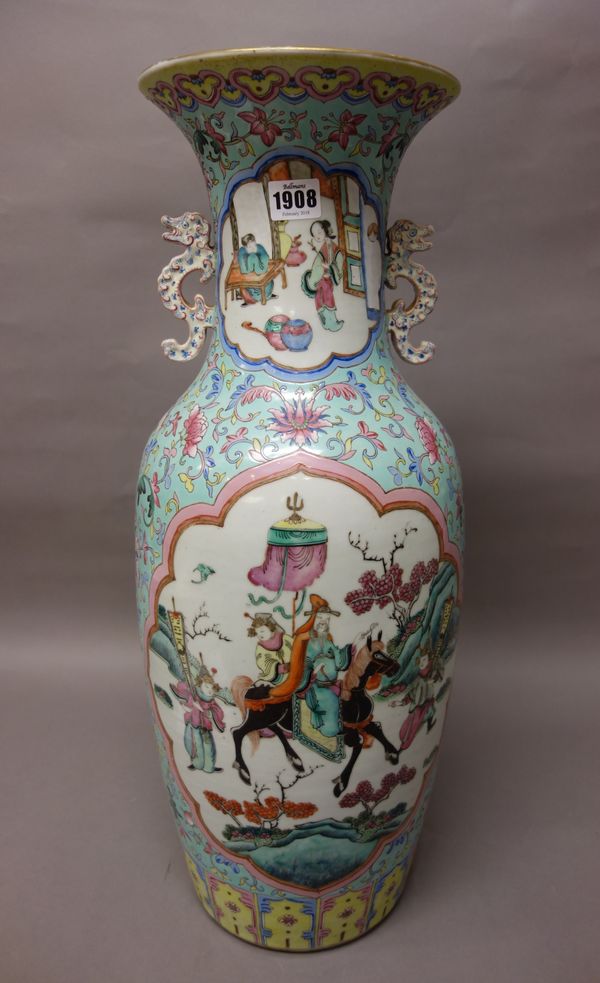 A large Chinese famille-rose two handled baluster vase, late 19th century, each side painted with a figurative panel inside a barbed frame against a t