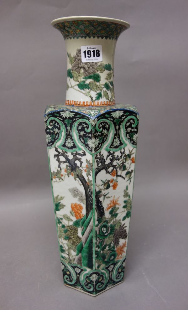 A Chinese famille-verte vase, late 19th century, of tapered hexagonal form, painted with panels of flowering shrubs, (a.f), 44cm. high.