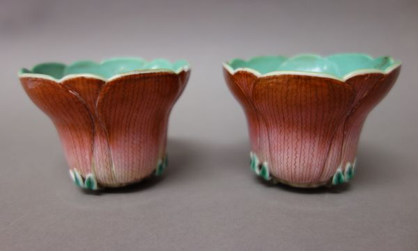 A pair of Chinese porcelain cups, 20th century, each in the form of a lotus flower, turquoise interiors, 6cm. high