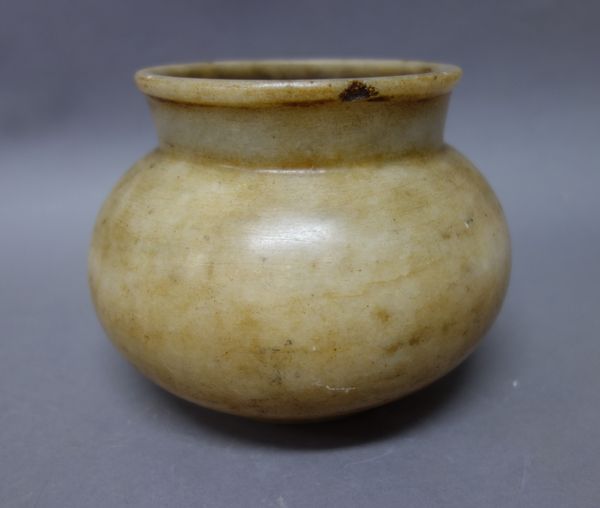 An Indian marble turned vase, probably 19th century, of compressed globular form, 12cm. high.