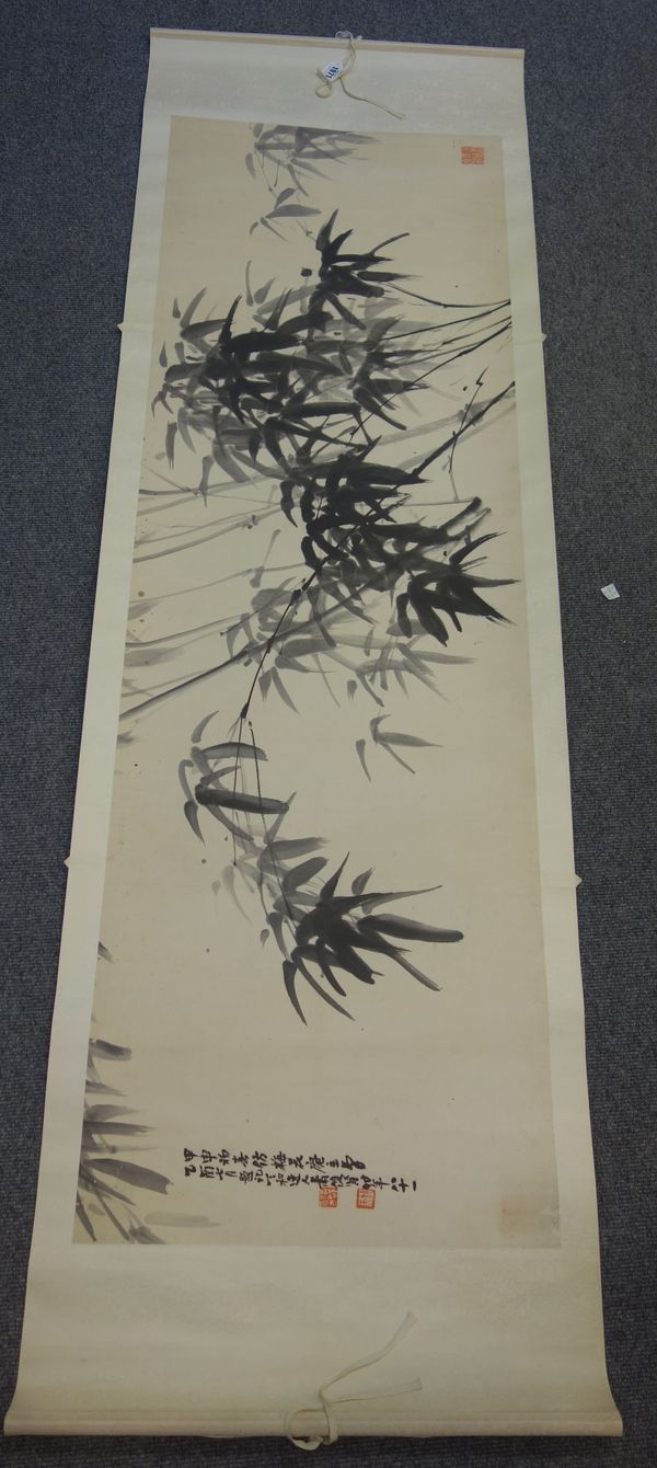 Two Chinese scroll paintings, 20th century, the first painted with branches of flowering jasmine, grapes and a vase, the second painted in ink with ba