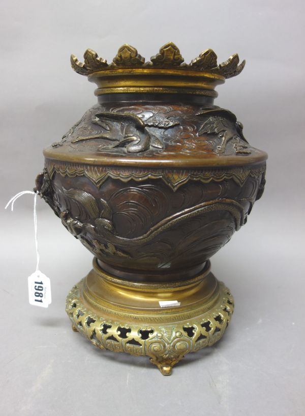 A Japanese bronze vase, Meiji period, the body cast in high relief with a dragon amongst cloud scrolls, the shoulders with birds in flight, gilt-metal