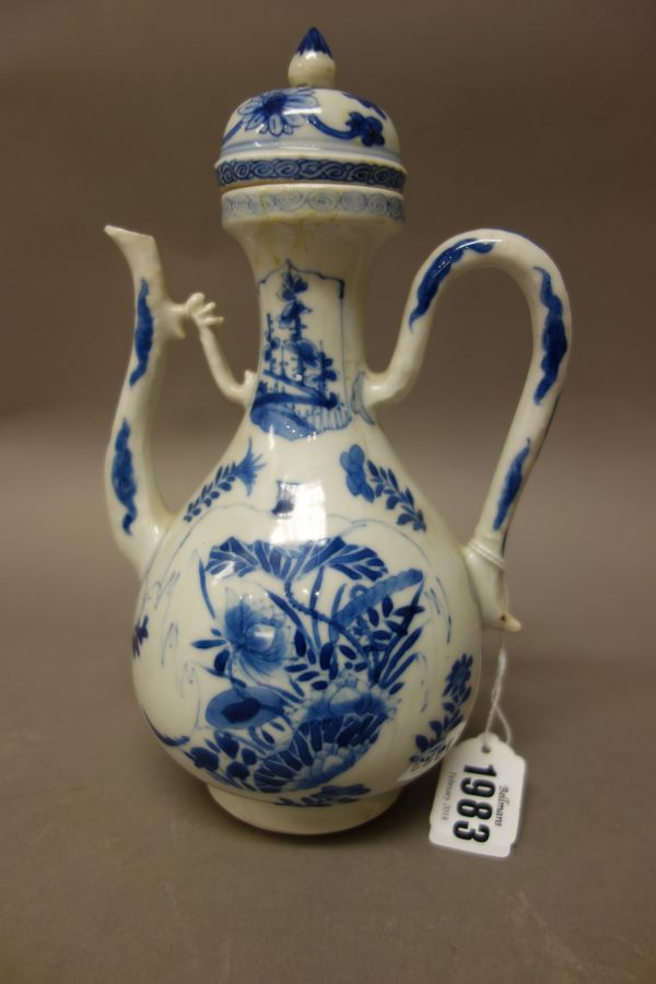 A Chinese blue and white wine ewer and matched cover, Kangxi, of pear form, each side painted with flowers, the waisted neck painted with two flower p