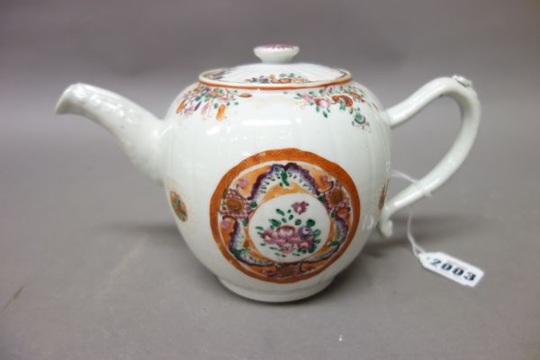 A Chinese famille-rose export teapot and cover, Qianlong, of ribbed bullet shape, painted each side with a circular roundel enclosing flowers and inse