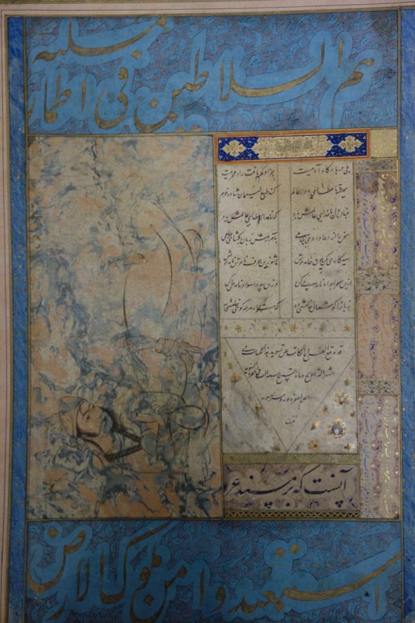 A Persian album page, possibly 17th century, depicting a reclining figure painted in pen and ink against a marbled ground besides lines of calligraphy