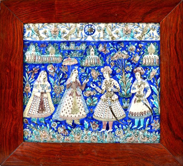 A Qajar rectangular pottery moulded tile, Persia, late 19th century. moulded with four courtly figures standing in a landscape with pavilions in the d