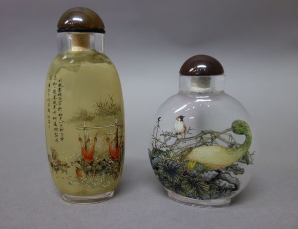 A Chinese inside painted glass snuff bottle, 20th century, painted with birds in branches, signed, 5.75cm. high; also a slender inside glass snuff bot