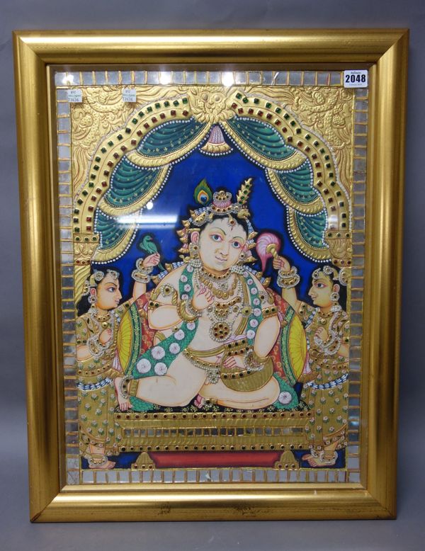 Krishna with attendants, Tanjore, South India, late 19th/early 20th century, gouache, gold and inlaid glass on wood, 57cm by 43cm, framed and glazed.