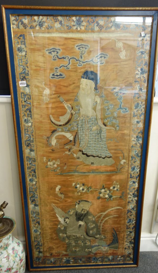 Two Chinese silk embroidered panels, 19th century, worked with four Immortals amongst bats, flowers and cloud scrolls, 146cm. by 68.5cm., framed and g