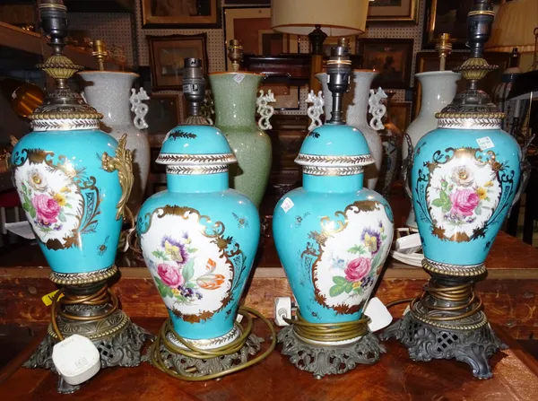 A pair of 20th century blue and gilt floral decorated table lamps with gilt metal fixtures and a similar smaller pair, (4).  K3
