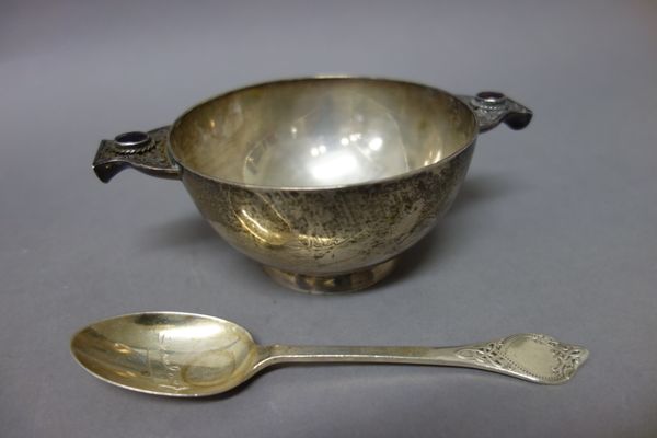 An Irish silver twin handled christening porringer of circular form, the gem set handles with Celtic inspired decoration, raised on a circular foot, D