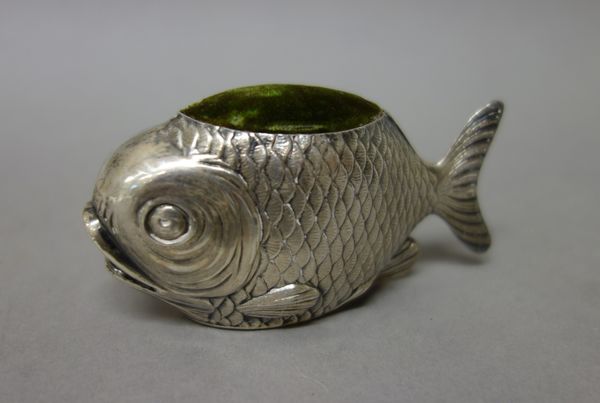 A silver novelty pin cushion, designed as a fish, length 9cm, Chester possibly 1908, maker S. Mordan & Co.   14.1.  Illustrated