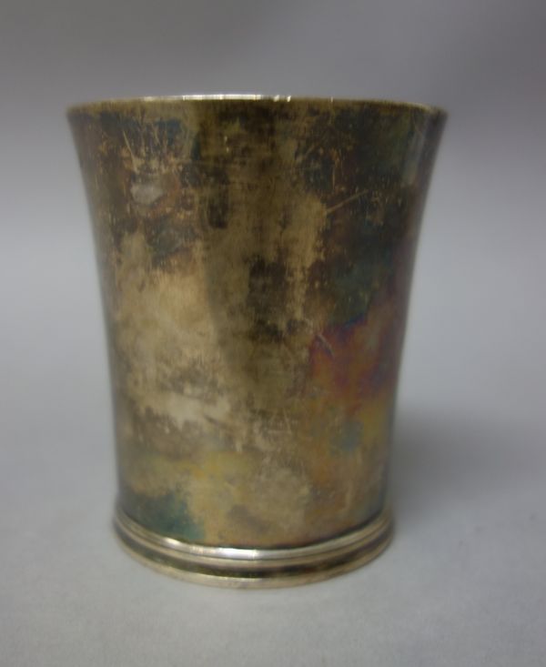 A George III silver beaker, of tapered cylindrical form, height 8.3cm, London 1790, weight 130 gms.     13.1