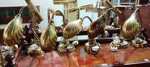 A group of five similar early 20th century anglepoise table lamps with brass shell shaped shades, (5).  G8
