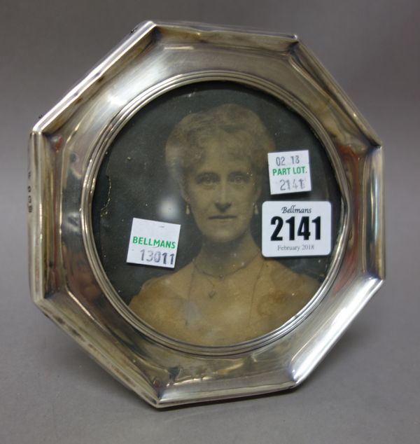 Silver and silver mounted wares, comprising; an octagonal photograph frame, having a circular aperture, Birmingham 1913, a silver lidded faceted glass