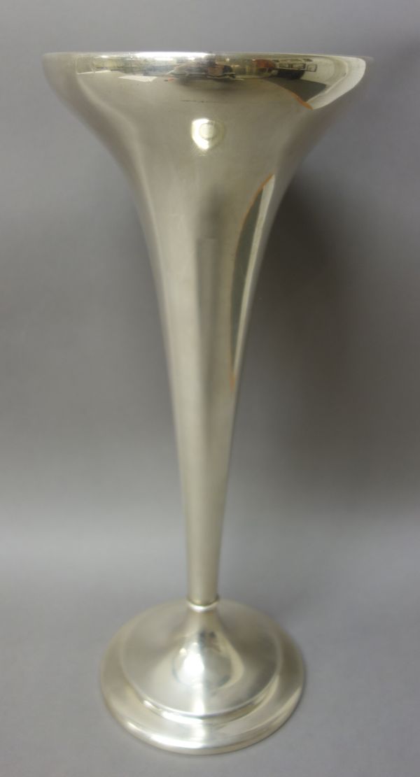 An American Sterling trumpet shaped vase, initial engraved, raised on a loaded circular foot, height 38.5cm.