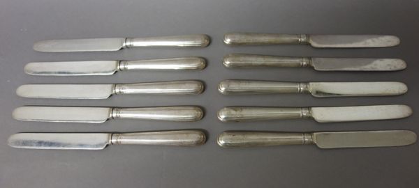 Ten silver handled fruit or dessert knives, having plated blades, the loaded handles London 1913, (10).