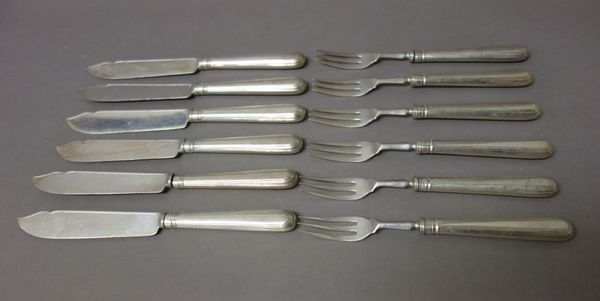 Twelve silver bladed fish knives, London 1913, having loaded silver handles, eleven silver pronged fish forks, London 1913, having loaded silver handl