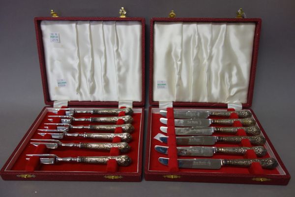 A set of six King's pattern tea knives having loaded silver handles and steel blades, cased, a set of six King's pattern tea forks having loaded silve