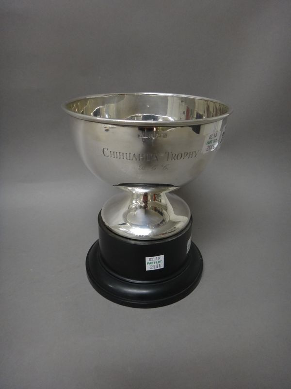 A silver trophy bowl, raised on a circular foot, diameter 15.5 cm, presentation inscribed, Birmingham 1963, weight 276 gms, with a black stand.