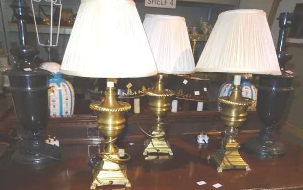 A pair of 20th century bronzed metal urn shaped table lamps and three smaller brass examples, (5).  J2