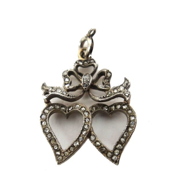 A rose diamond set pendant, designed as two open hearts, with a ribbon tied bow surmount, fitted with a boltring (one diamond lacking). BC42