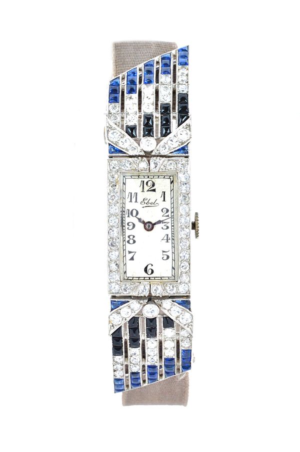 An Ebel platinum cased, cabochon sapphire, cabochon black onyx and diamond set ladies dress wristwatch, with an unsigned oval jewelled lever movement,