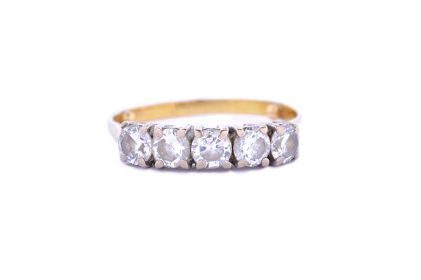 A gold and diamond set five stone ring, claw set with a row of circular cut diamonds, ring size L (note arthritic bobbles obscuring the hallmark).  Il