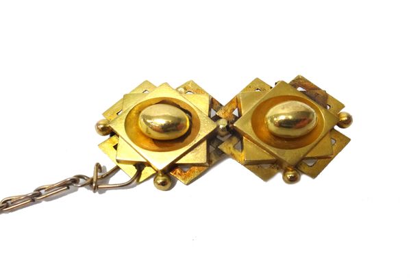 A Victorian gold brooch of twin section form, decorated with central hollow ovals and with beads to the borders (as converted from a pair of earrings)