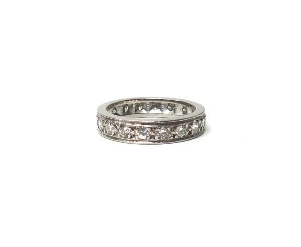 A white gold and diamond set full eternity ring, mounted with circular cut diamonds, indistinctly detailed '18ct', ring size K.