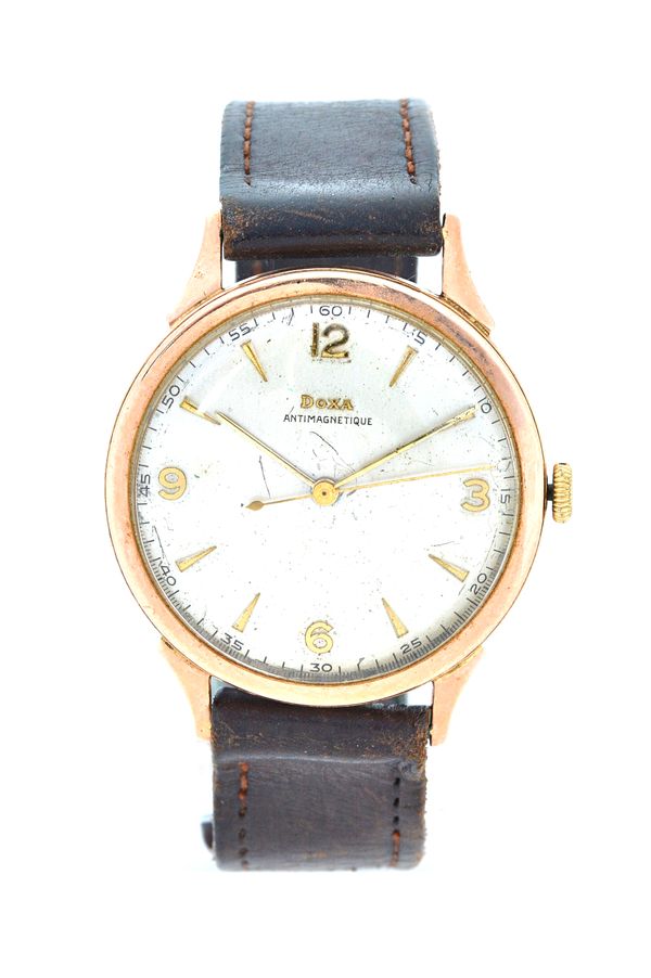 A Doxa gold circular cased gentleman's wrist watch, with a signed jewelled movement, the signed silvered dial with gilt Arabic and arrow shaped numera