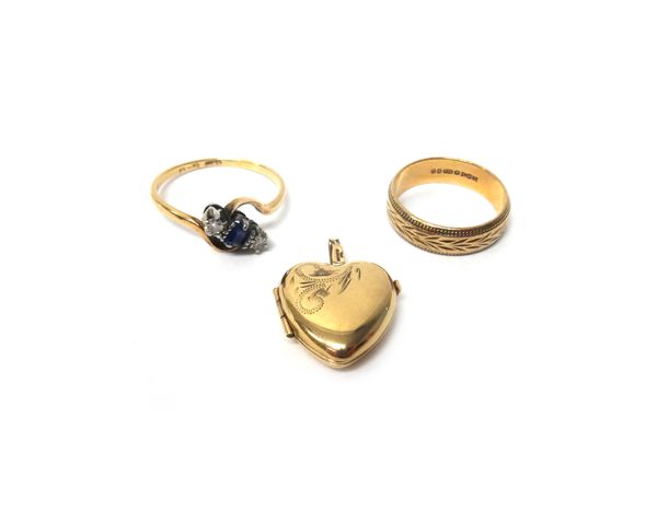 A gold and platinum, sapphire and diamond set three stone ring, claw set with the rectangular cut sapphire at the centre, between two circular cut dia