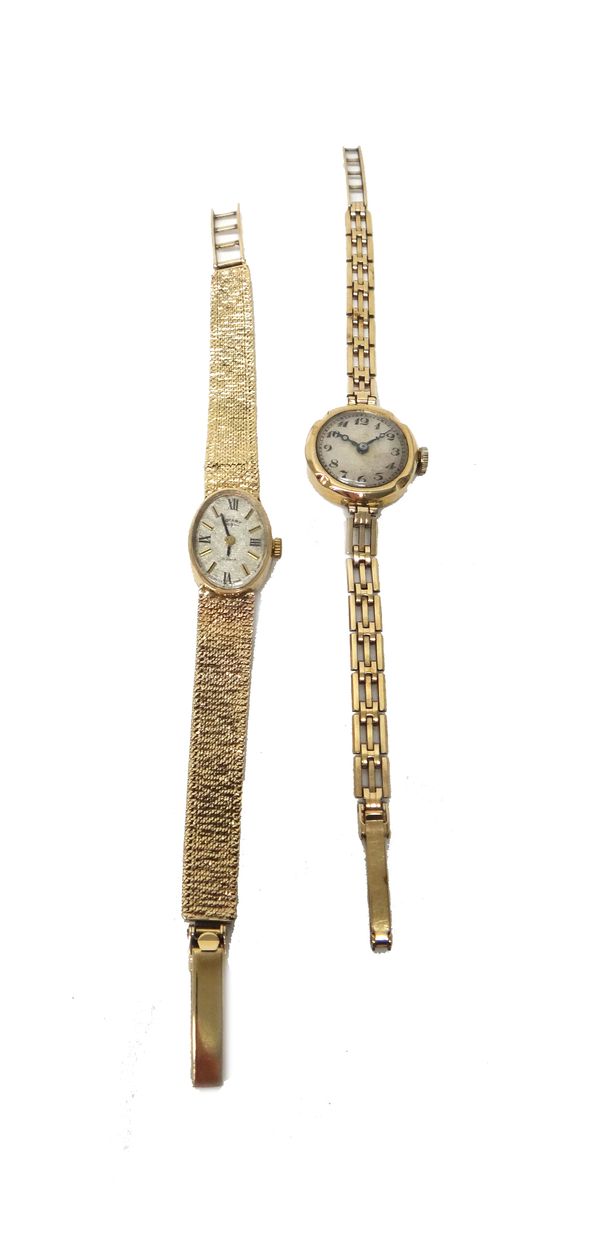 A Rotary 9ct gold lady's bracelet wristwatch, the signed oval silvered dial with baton shaped and Roman numerals, on a tapering textured link bracelet