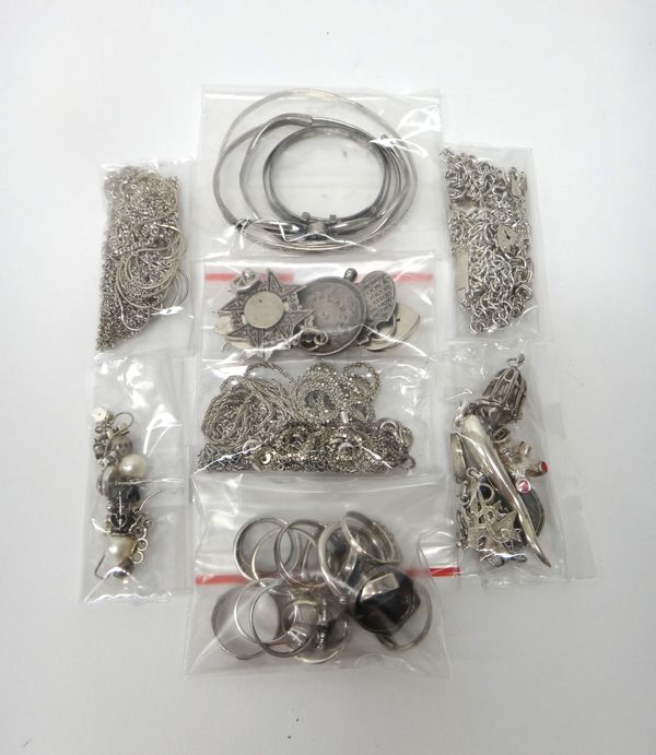 Mostly silver jewellery, comprising; fourteen rings, seven bracelets, five bangles, eleven pendants and charms, a brooch, twenty neckchains and neckla