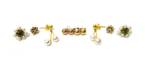 A pair of gold and cultured pearl pendant earrings, a pair of gold, cultured pearl and peridot cluster ear studs, two pairs of gold bead ear studs and