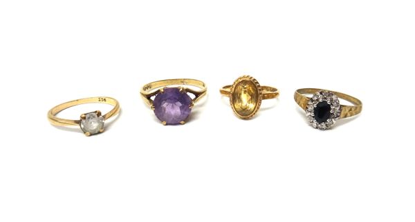 A 9ct gold, sapphire and diamond set oval cluster ring, a 9ct gold ring, claw set with a circular cut amethyst, a 9ct gold ring, collet set with an ov