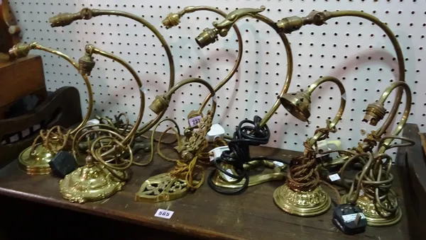 Nine 20th century brass swan neck table lamps, (9). D9