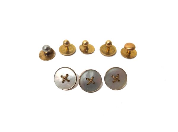 A pair of gold studs, detailed '18', three further gold studs and three gold mounted mother-of-pearl dress buttons, detailed '9C', gross combined weig