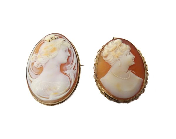 A gold mounted oval shell cameo brooch, carved as the portrait of a lady, within a swirling surround, in an Art Nouveau inspired design, detailed 9 C,