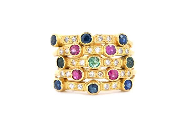 An 18 ct gold, diamond, ruby, emerald and sapphire set harem ring, in a five row design mounted with circular cut coloured gemstones, interspaced with