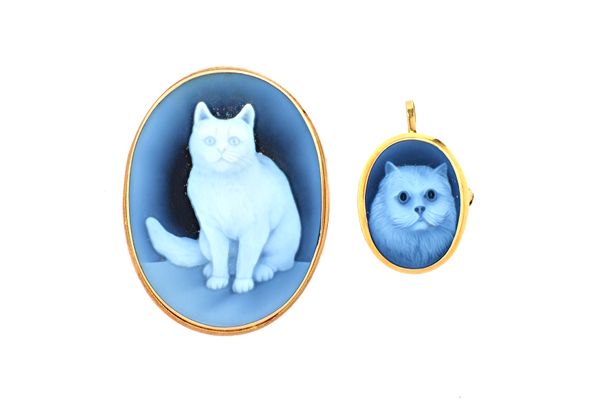 A gold mounted oval agate cameo pendant brooch designed as a seated cat, detailed '375' and a gold mounted oval agate cameo smaller pendant brooch des