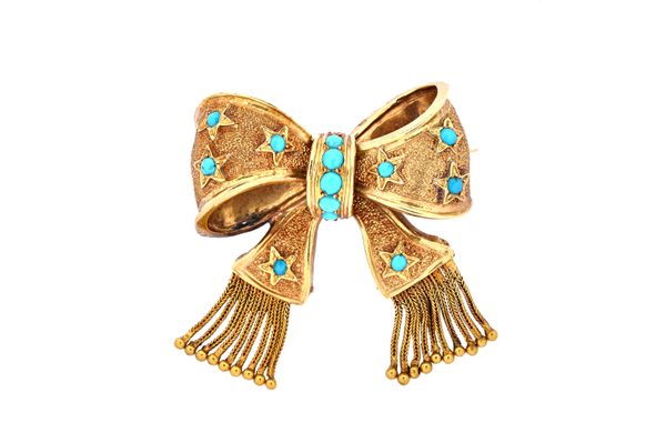 A Victorian gold and turquoise set brooch designed as a ribbon tied bow, with bead ended tassel terminals, gross weight 9.5 gms, with a case.  Illustr